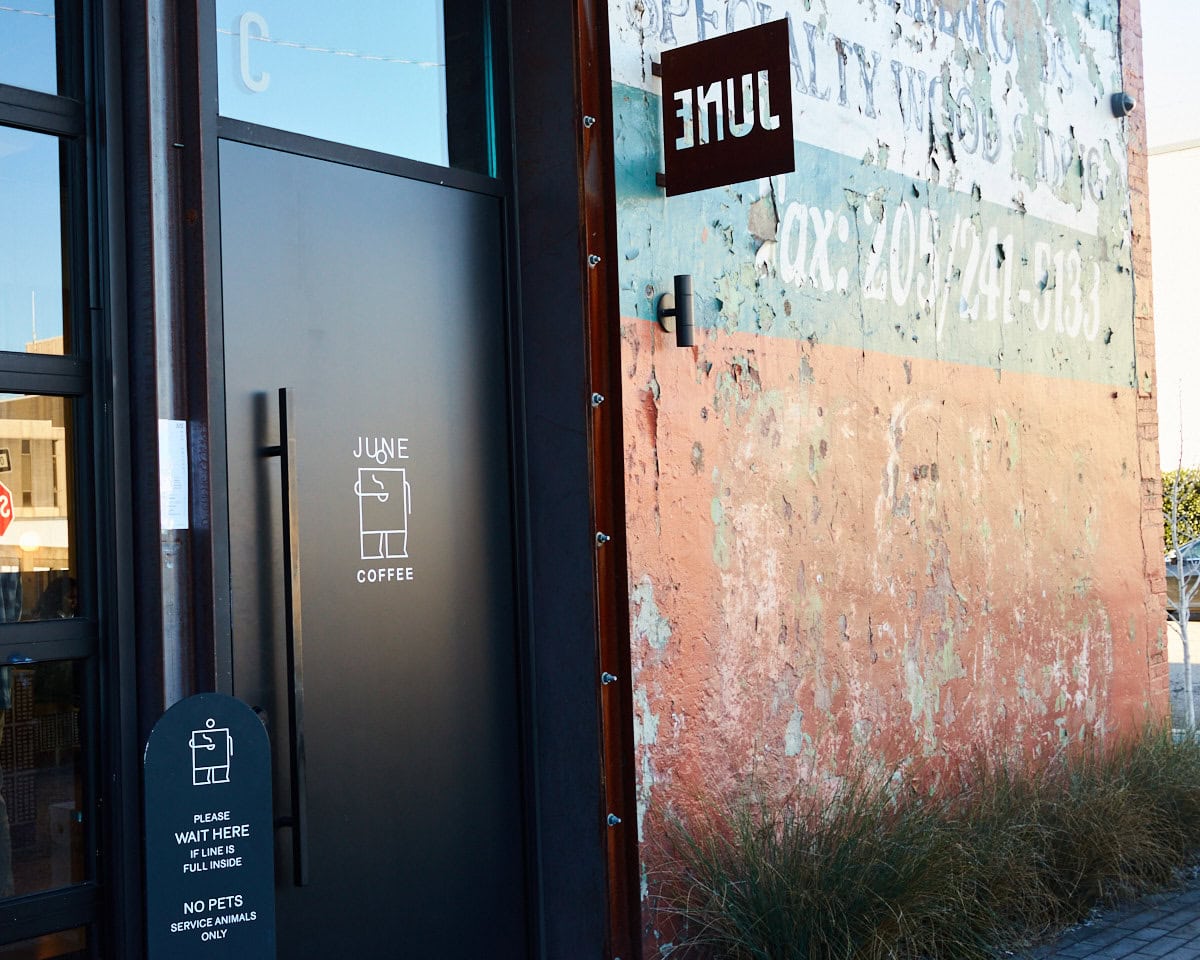 June Coffee door with rustic paint chipped wall
