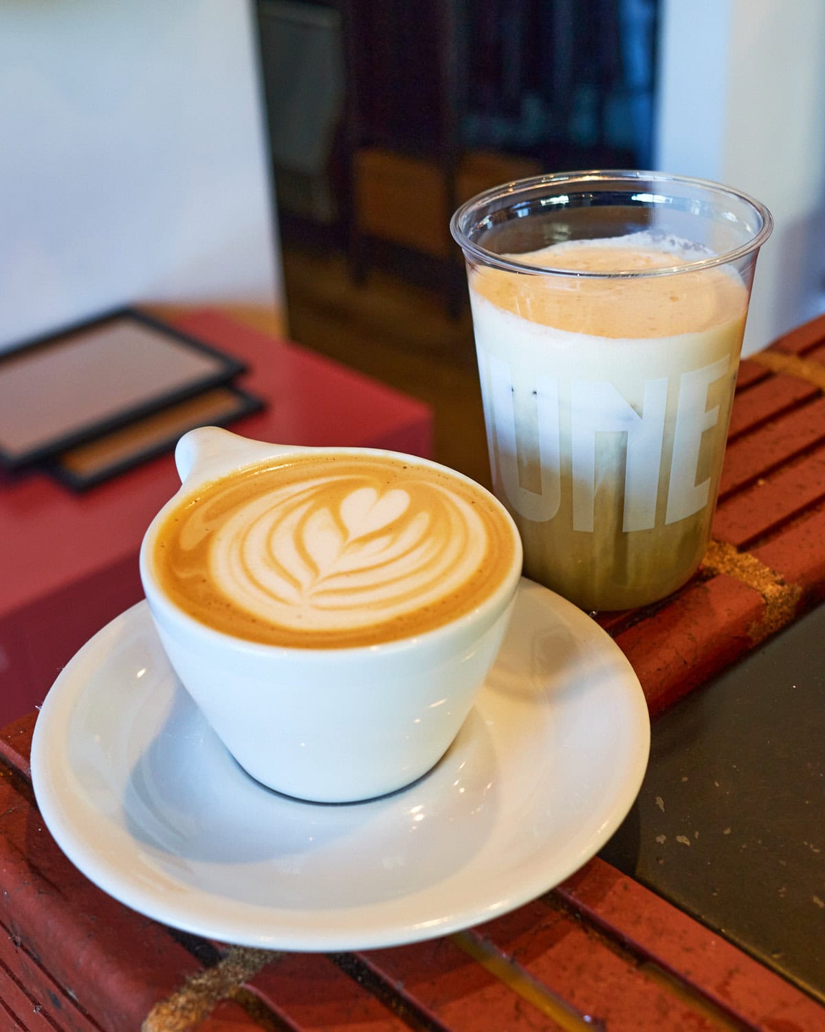 June Coffee Flat White and Iced hojicha latte topped with cream