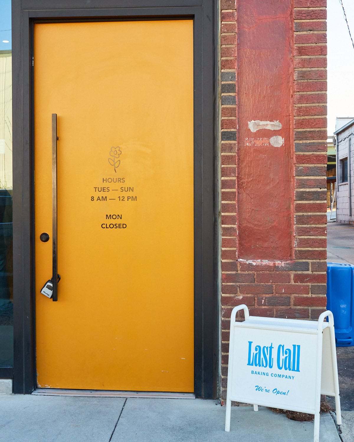 Yellow front door for Last Call Baking Company