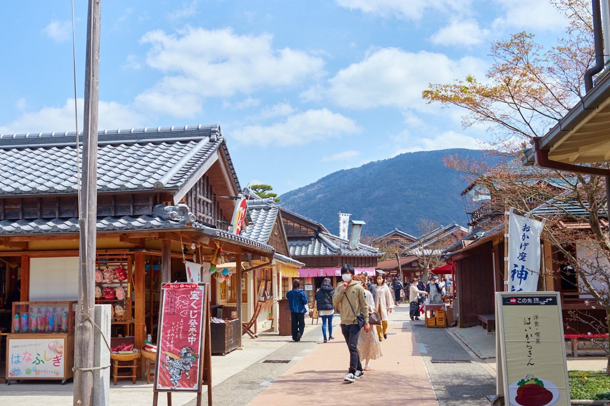 Okage Yokocho street view with mountain in the background