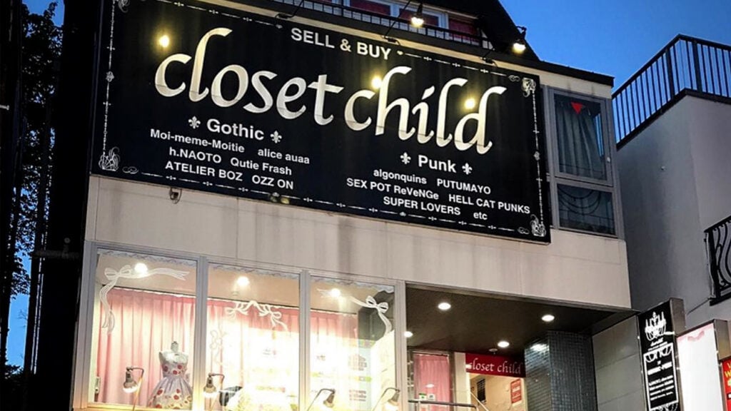 Closet Child shop sign and window. The window has one mannequin wearing a lolita dress.