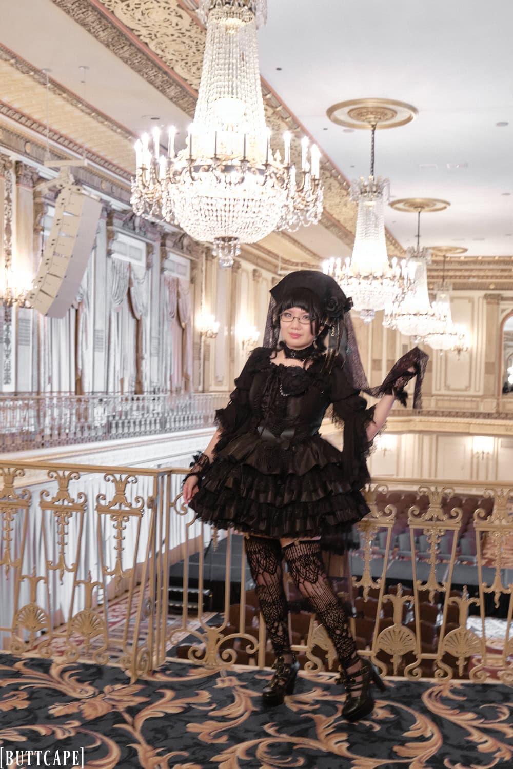 Full body photo of the same gothic lolita outfit in a different pose.