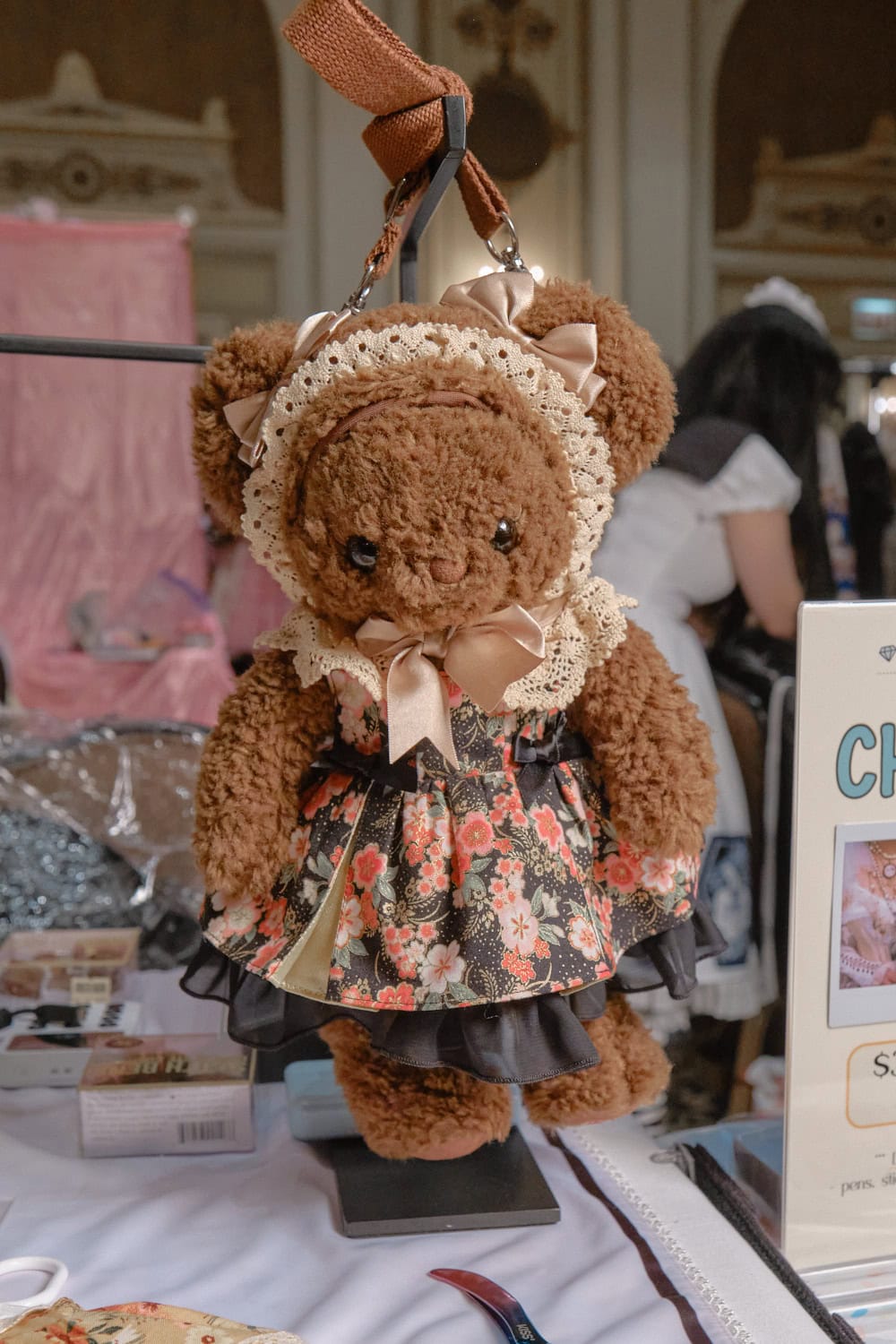 Stuffed bear bag wearing a kimono print dress.