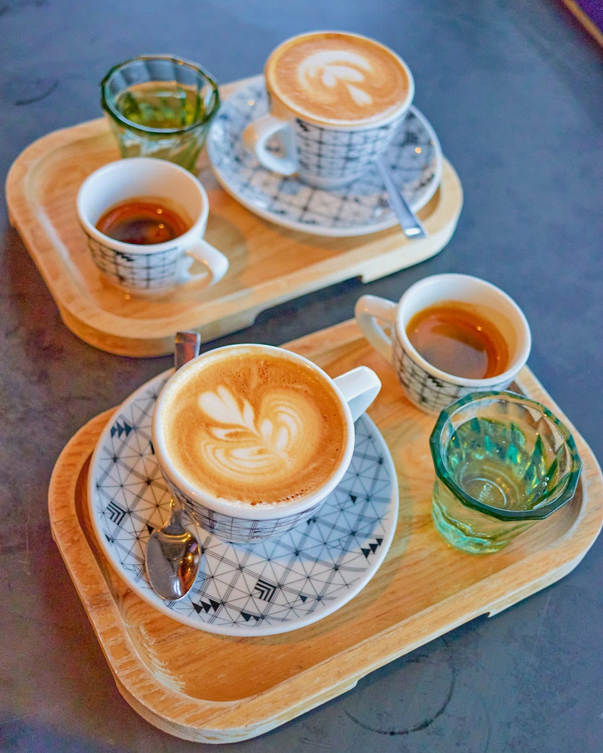 Blacksmith competition cappuccino with a shot of espresso and a side car of bubbly water on a trey
