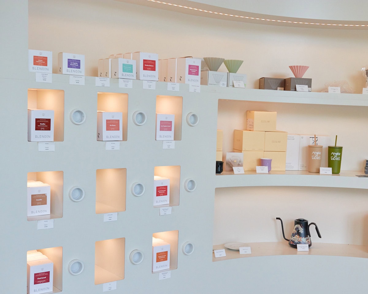 BlendIn Coffee Club Retail Goods selection with house roasted coffee beans, origami coffee droppers, and kettles