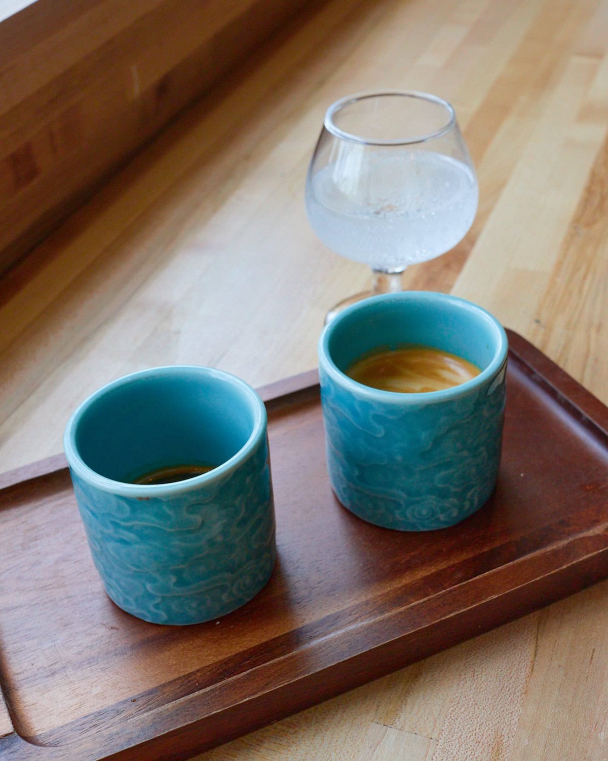 Cortado with a single shot of espresso on the side and a sidecar