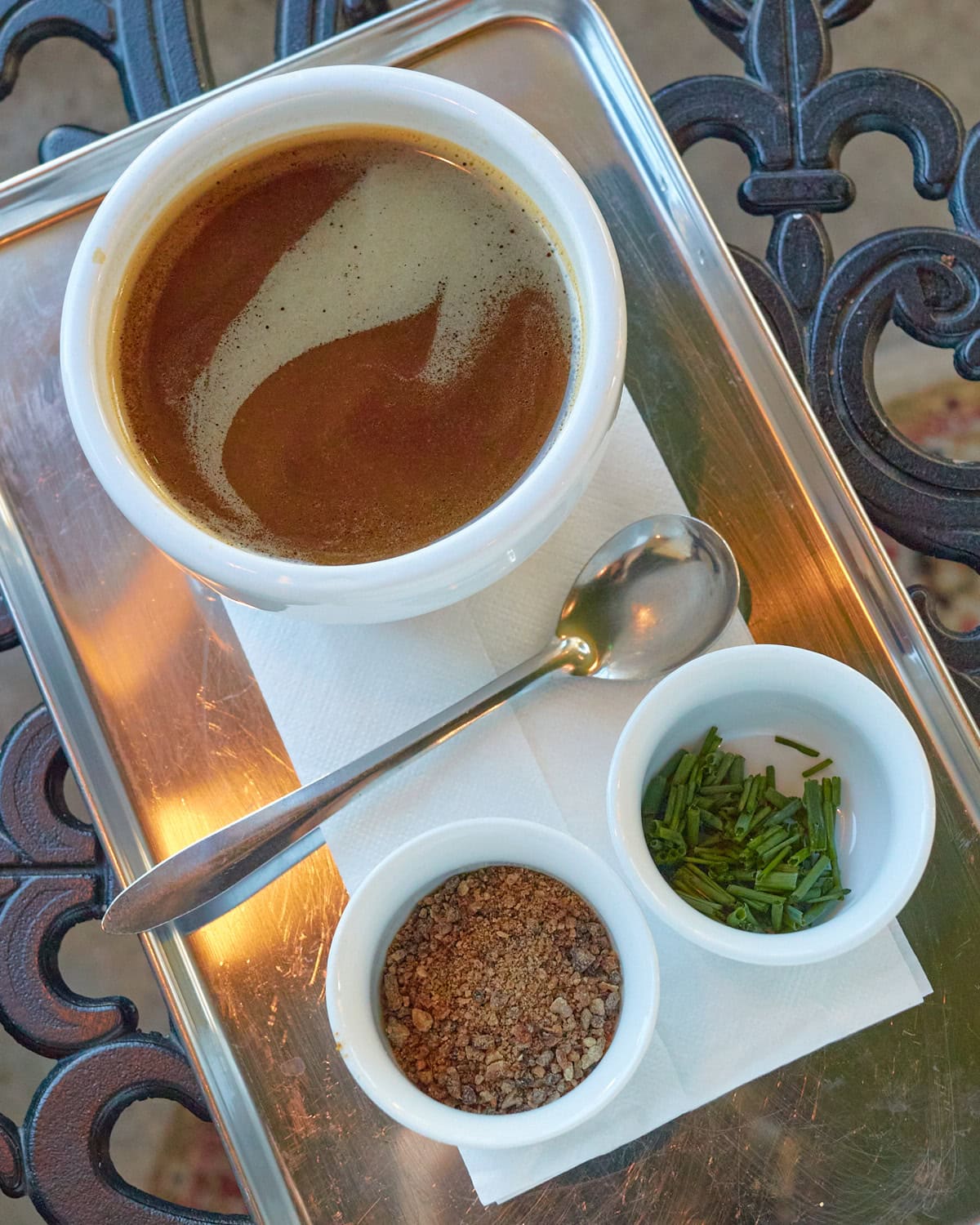 Seasonal New Heights Coffee Roasters coffee soup with mushroom powder and green onion on the side