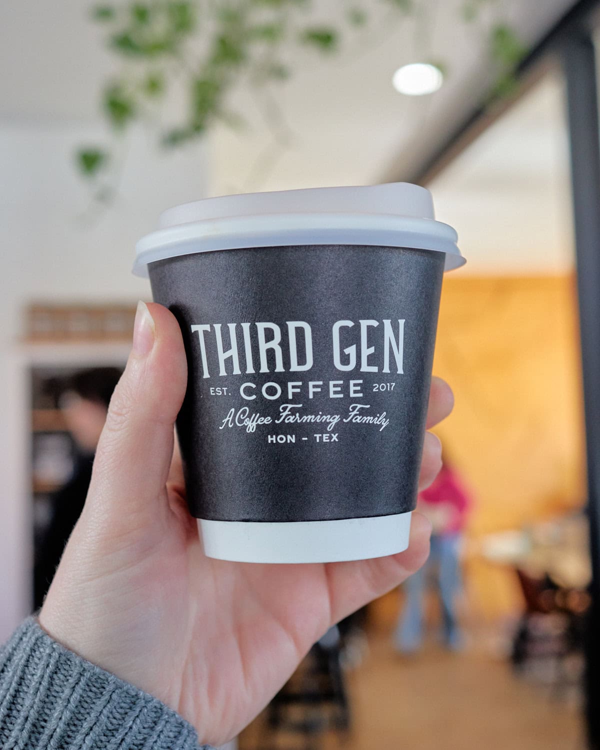 black and white coffee cup with third gen coffee logo