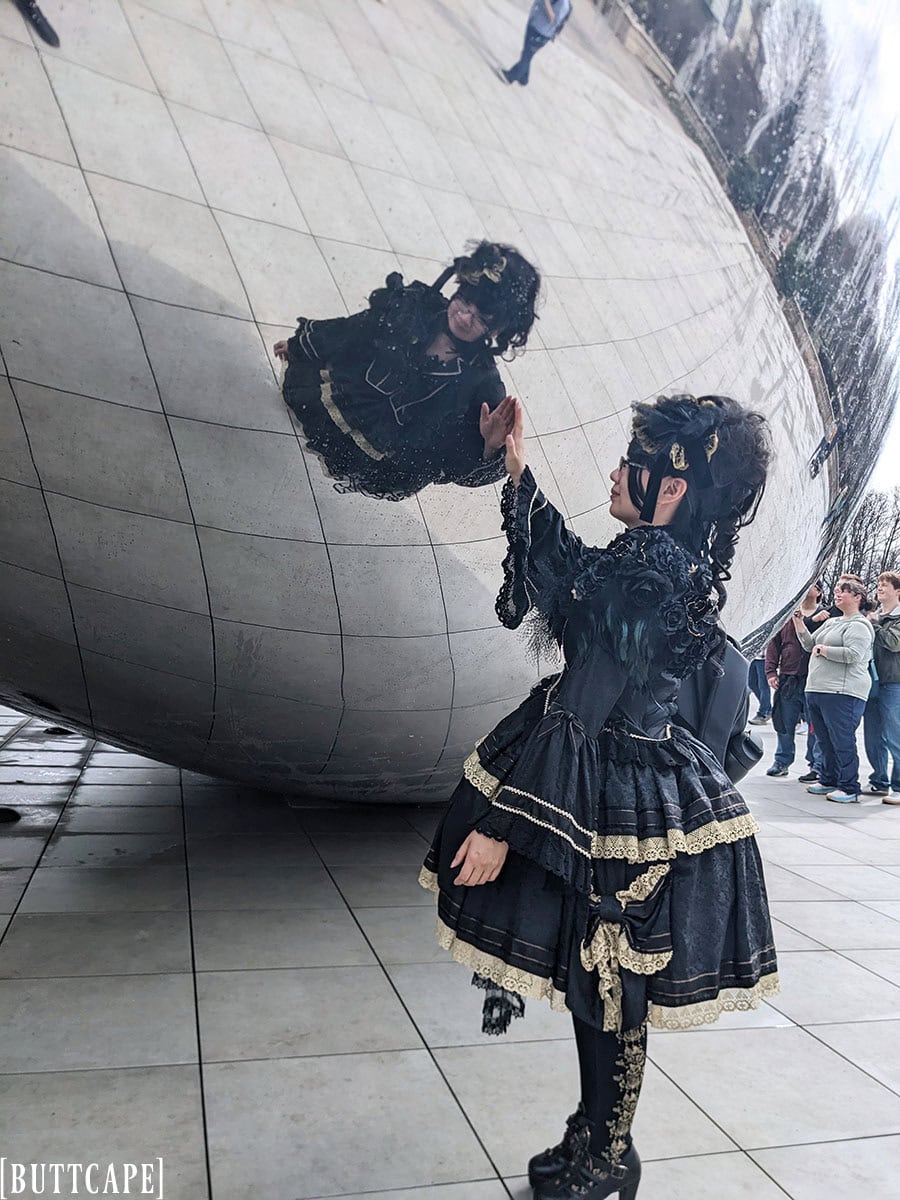 Stephano touching the Cloud Gate sculpture.